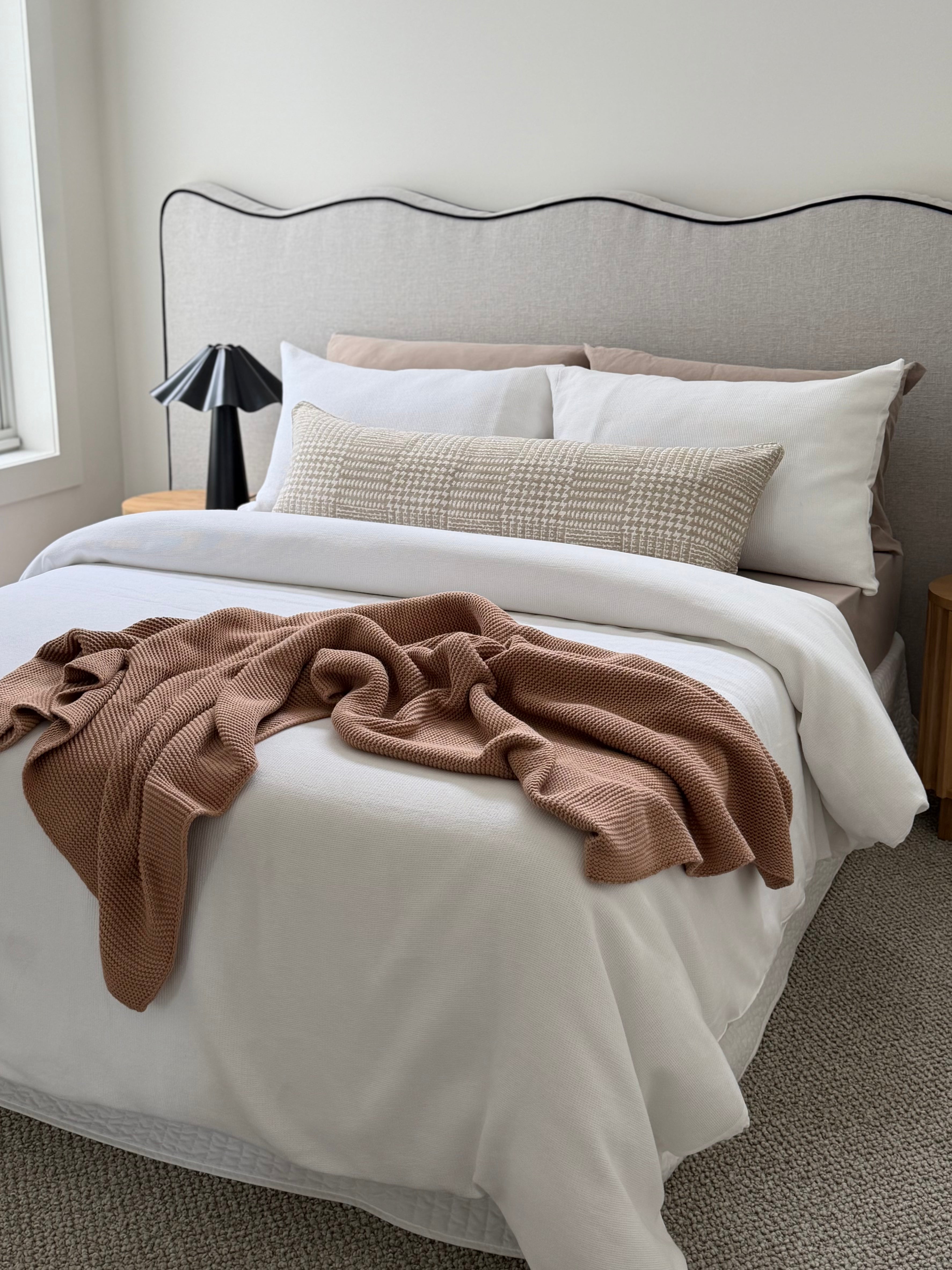Terrain Coconut beige geometric long lumbar cushion, 105x38cm, styled across a bed