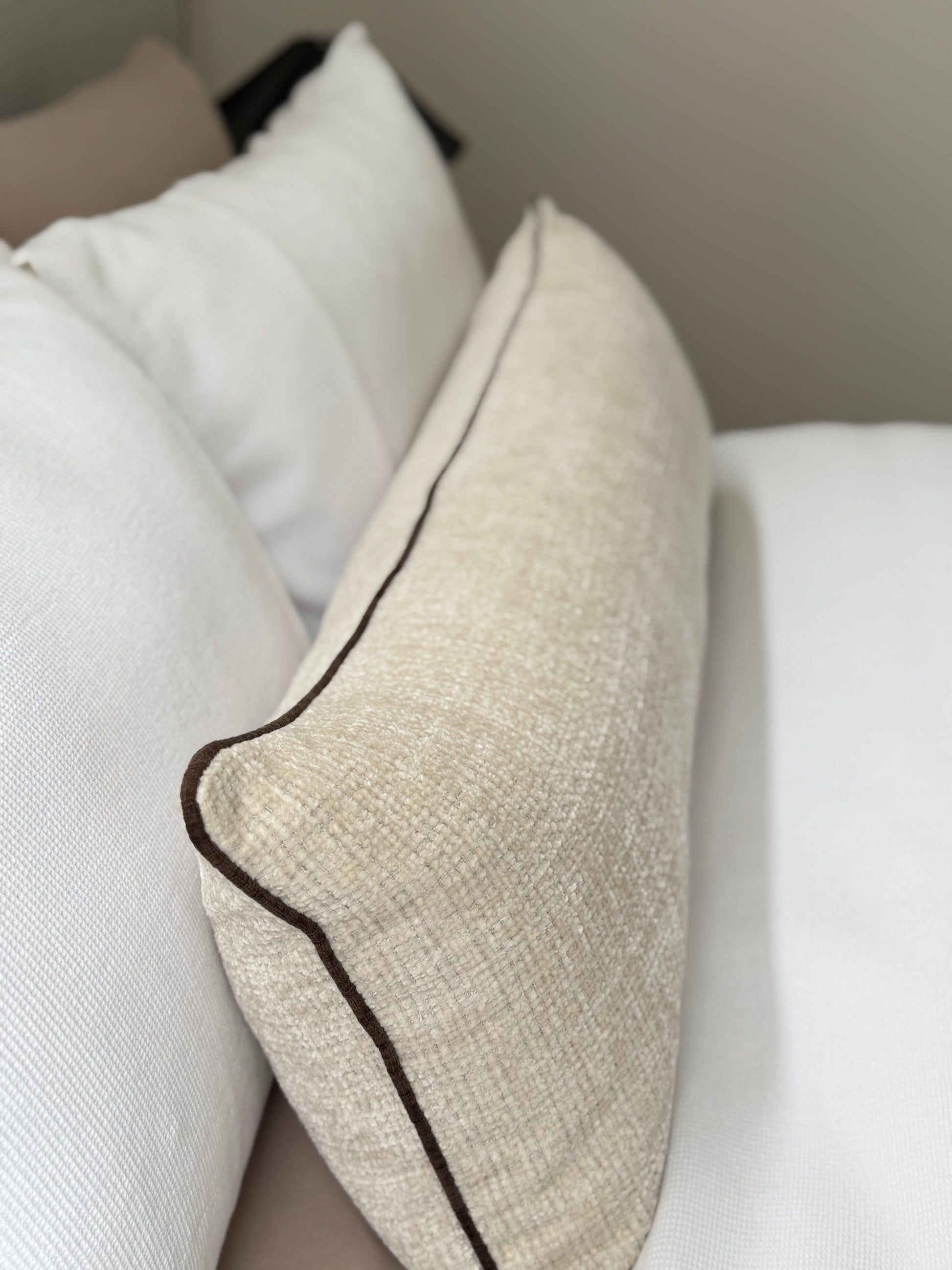 Conway Chalk long lumbar cushion, textured cream woven fabric with chocolate piping