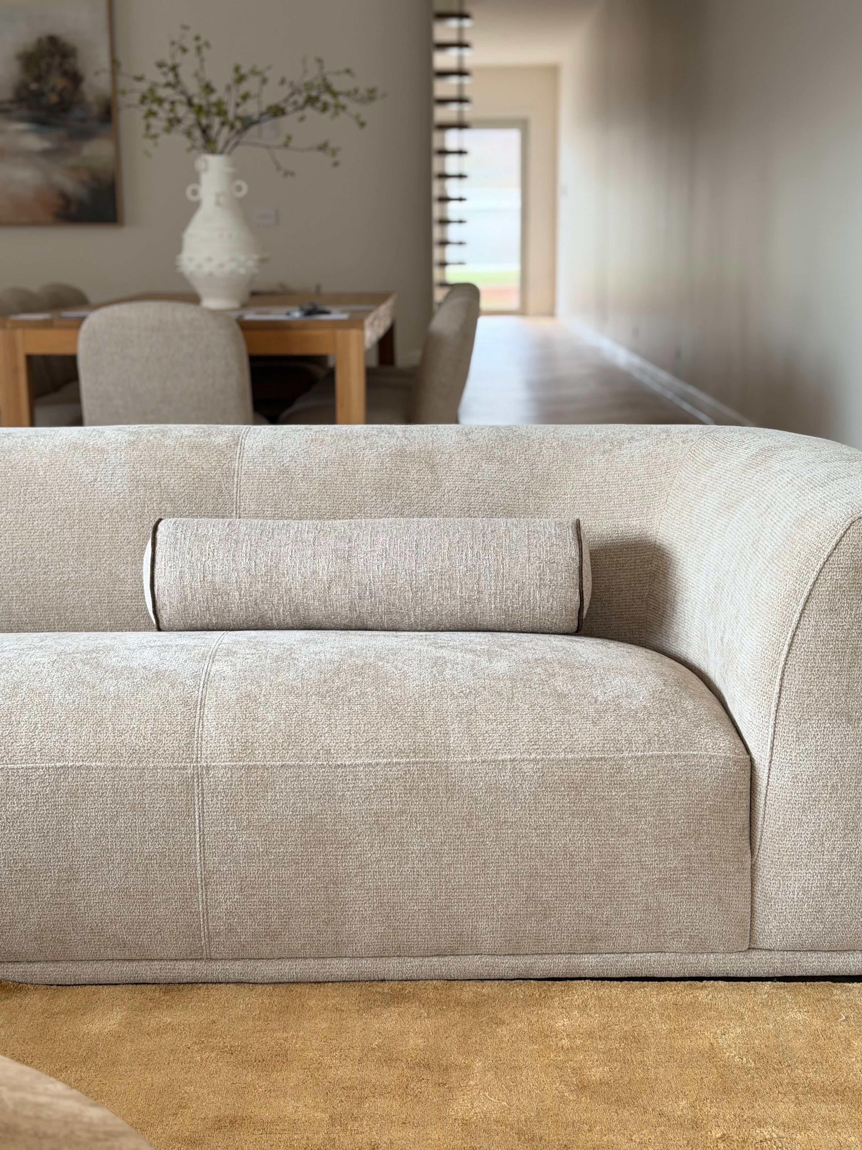 Essa Sandstone beige bolster cushion with Dion Mocha piping, 65x18cm